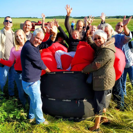 Smiling Passengers back on the ground after their Windermere and Lake District BallooningSmiling Passengers back on the ground after their Windermere and Lake District Ballooning